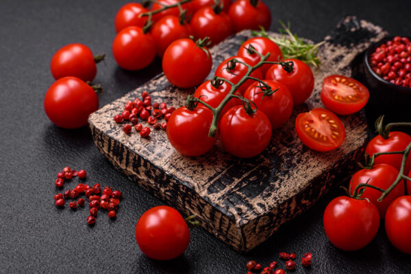 Delicious fresh cherry tomatoes on the branches as an ingredient Pomodoro Baxter semi